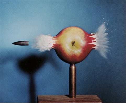 bullet peircing an apple Circa 1964